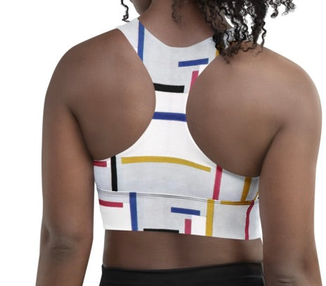 Back view of striped geometric longline sports bra with racerback design.