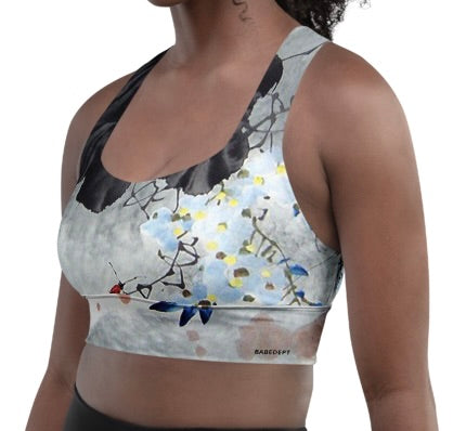 Model wearing Babe Dept sports bra front view with Japanese art pattern and black edging.